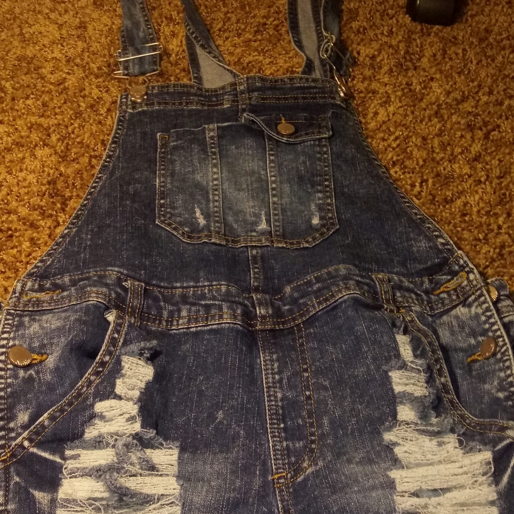 Ripped jean overalls